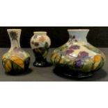 A Moorcroft pottery Blackberries pattern compressed ovoid vase, 11cm high, 13cm diameter; others