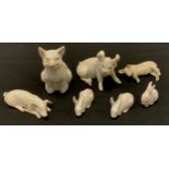 three Royal Copenhagen porcelain figures, Rabbits; others Hutschenreuther etc Pigs (7)