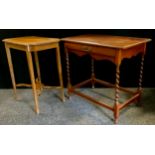 A early 20th century walnut side table, oversailing top, frieze drawer, barley twist legs united