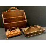 An oak two division magazine rack; cutlery tray; standish with two lidded inkwells, frieze drawer,