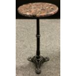 A Specimen-stone top wine table, cast iron tripod base, 60cm high x 30cm diameter