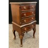 A George III style reproduction mahogany side cabinet / chest of drawers, serpentine shaped front,