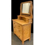 A Pine dressing chest, bevelled rectangular mirror, with pair of small drawers, above three