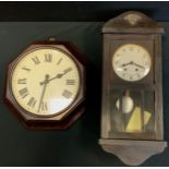 A mid 20th century GPO (General Post Office) octagonal bakelite wall clock, removed from the