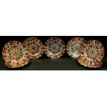 Seven Royal Crown Derby 1128 Imari wavy rim plates, all first quality, 22cm diameter, printed