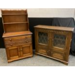 An ‘Old Charm’ style Bijou oak dresser, plate-rack top, two long drawers to frieze, pair of small