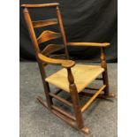 A late 18th century elm ladder-back rocking chair, 94.5cm high (38cm to seat) x 65cm wide x 68cm