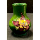 A Moorcroft pottery Anemone Tribute pattern vase, Potter to the Late Queen Mary paper label to base,