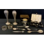 A silver christening cup, Birmingham 1926; twp napkin rings, etc, 3.2ozt; pair of Indian silver
