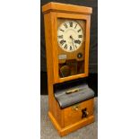 A National Time Recorder Co Ltd clocking in clock, Aquinas Street, London SE1, golden oak case, cast
