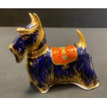 A Royal Crown Derby paperweight, Scottish Terrier, 14cm long, gold stopper, red printed marks and