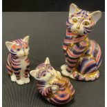 Three Royal Crown Derby paperweights, Cat, Kitten and Playful Kitten, all decorated in the Imari