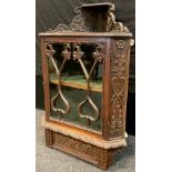 A Victorian, ornately carved oak corner cabinet, wall-mounted, 90.5cm high x 58.5cm wide x 35cm, c.
