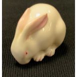 A Royal Worcester porcelain Rabbit netsuke, picked out in pink, printed marks, c.1926