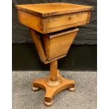 A Victorian walnut workbox, single drawer to frieze, octagonal column, shaped base, bun feet, 72.5cm