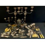 A pair of Victorian silver plated two branch candelabra, two scrolling arms, 45cm high, another