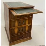 A Yew wood two-drawer filing cabinet, green tooled leather top, above a draw-out writing surface,