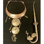 A white metal opium pipe; a decorative middle eastern collar necklace (2)