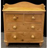 A Victorian pine chest of drawers, three-quarter galleried top, two short over two long drawers,