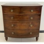 A Victorian, George III style, mahogany Bow-front chest of drawers, two short over three graduated