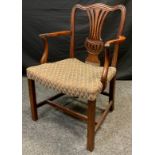 A 19th century Chippendale style mahogany elbow chair, serpentine top-rail, wheat sheaf splat,