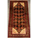 A North east Persian Meshed Belouch rug / carpet, 210cm x 110cm.