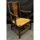 A George III walnut splat-back armchair, drop-in woven rush seat, 100cm high x 64.5cm wide, c.1760.