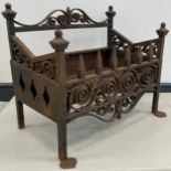 A Victorian forged and cast iron fire grate / fire basket, 52.5cm high x 61cm wide x 39cm, c.1850.