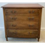 A Walnut chest of drawers, cross-banded top, four graduated long drawers, turned feet,