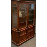 An Old Charm oak display cabinet, glazed leaded doors to top enclosing three tiers of glass