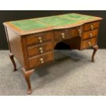 A mid 20th century mahogany knee-hole writing desk, bow-front centre, single drawer to frieze, three