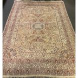 A large Middle Eastern carpet / rug, central circular medallion enclosed within a field of