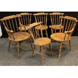 A set of six early 20th century elm and beech, spindle-back dining chairs, comprising four chairs,