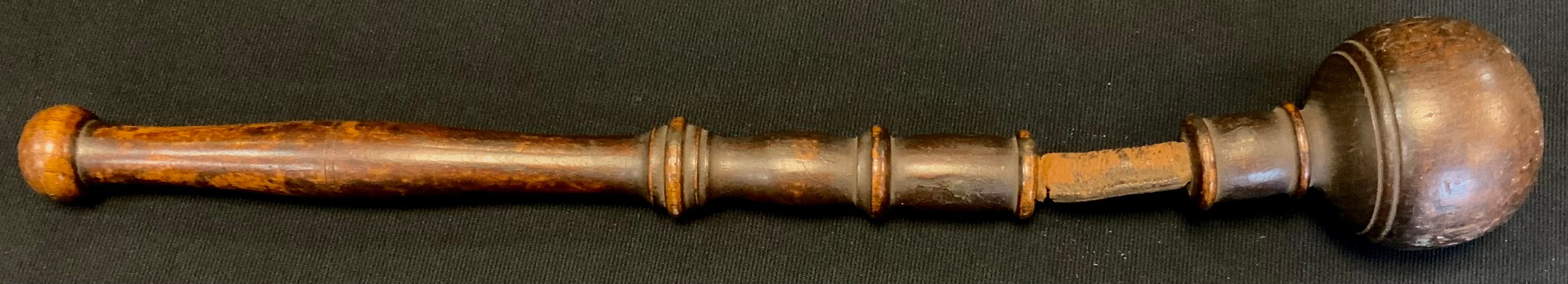 A 19th century turned wood and leather life preserver, turned handle, ball tip, leather