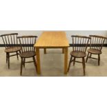 A set of four late 19th century spindle-back kitchen / dining chairs, circular elm seats, turned
