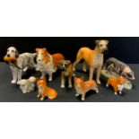 A Beswick model Great Dane standing; others Corgi, Old English Sheepdogs ; Alton Pointer with