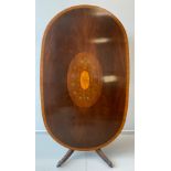 A reproduction Sheraton Revival tilt-top dining table, well figured mahogany top, with large