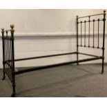 A Victorian cast iron and brass single bed frame.