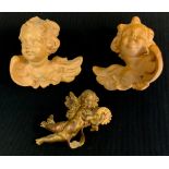 A pair of figures wall masks, as Cherub, another gilt (3)