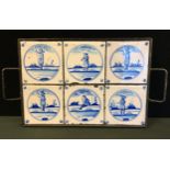 A set of six 18th century style Dutch Delft tiles, mounted in a later metal tray, each tile