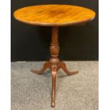 A George III oak tilt-top table, circular top, turned urnular-form pedestal, tripod base, 76cm