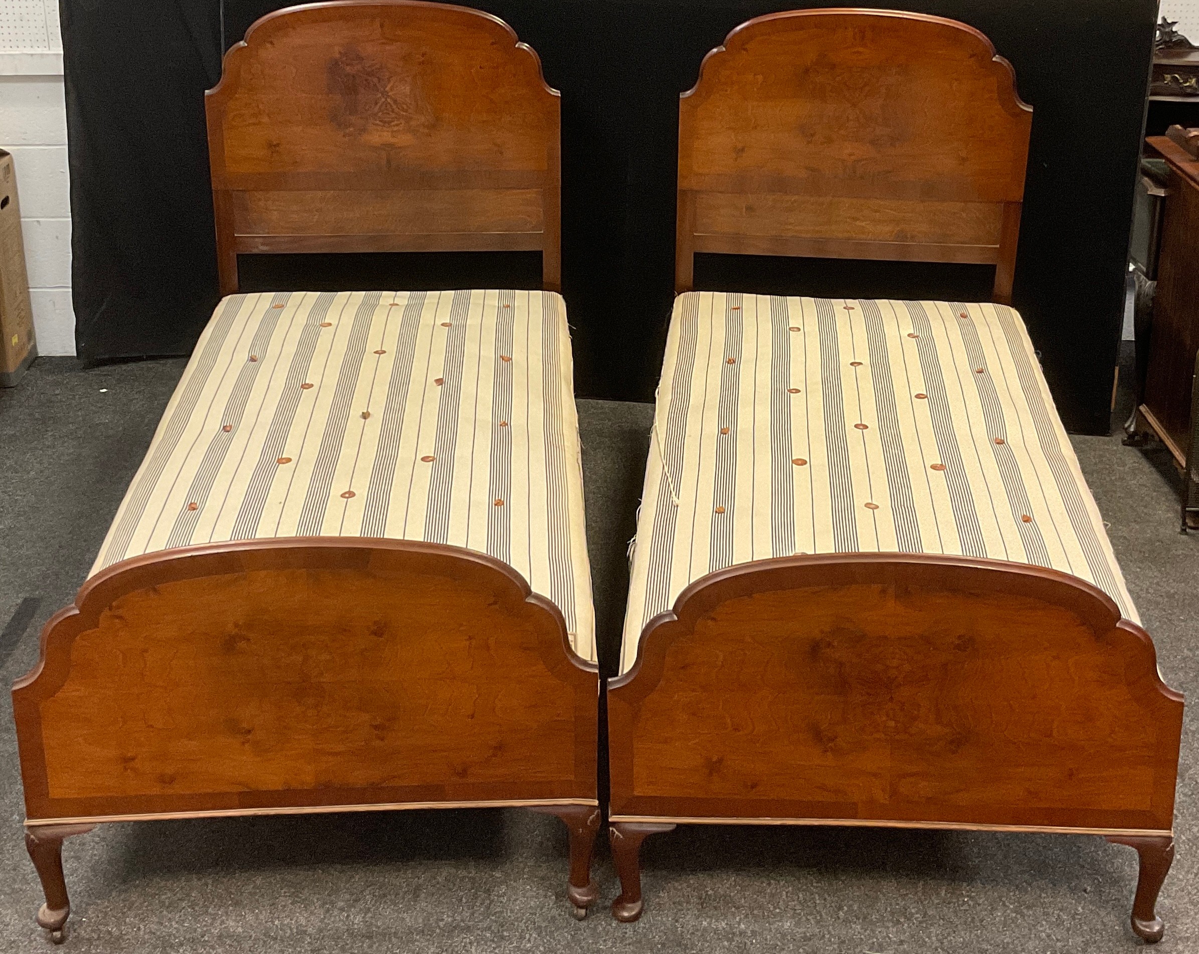 A pair of early to mid 20th century single beds - walnut head and foot boards, cast iron side rails, - Image 2 of 2