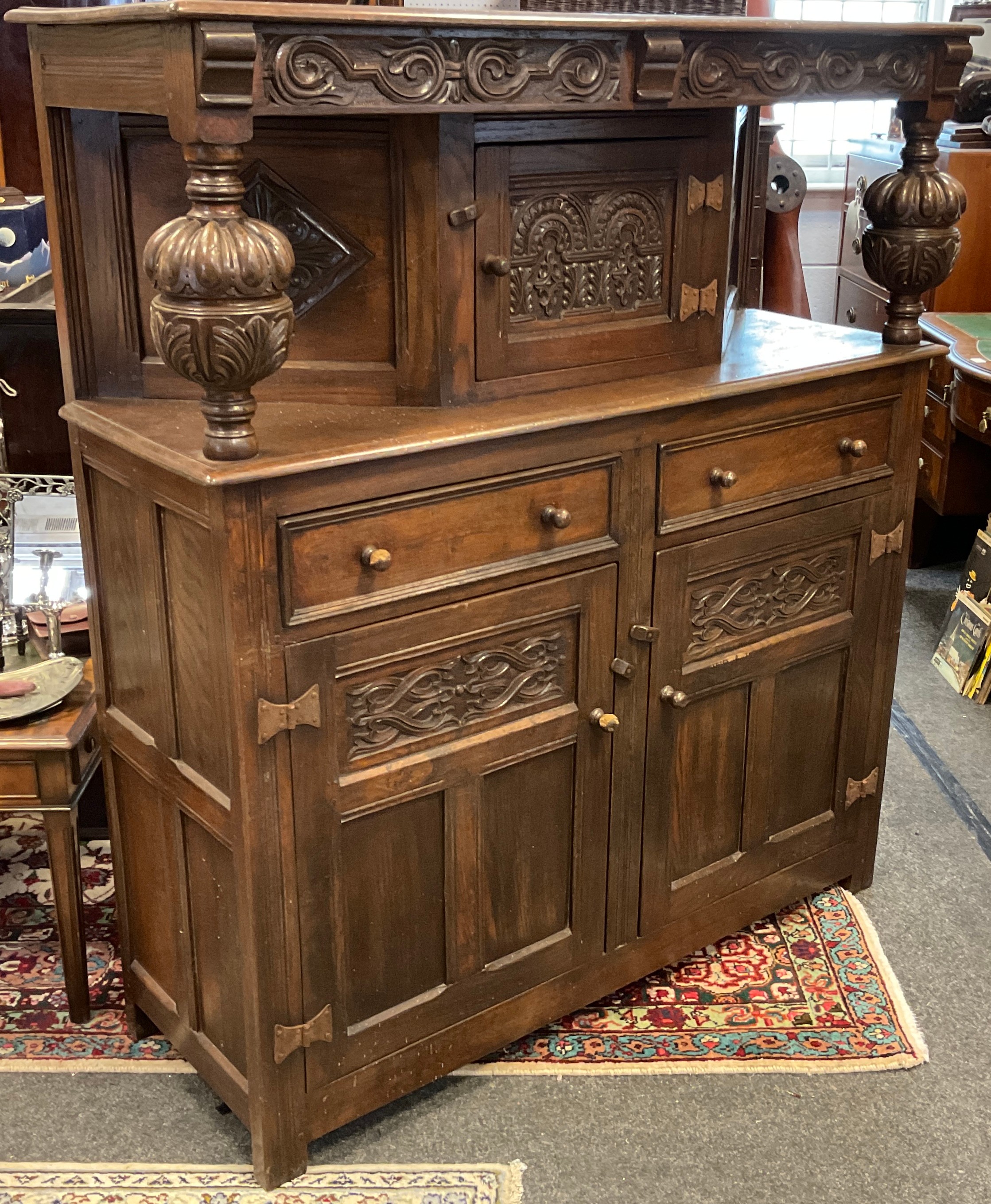 A carved oak court cupboard, 138cm high x 127cm wide x 44cm. - Image 2 of 2