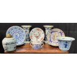 A collection of Delftware including plates, a pair of vases, etc