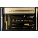 A Waterman's black fountain pen, gold coloured collared cap, lever fill mechanism, others