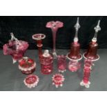 A pair of Victorian cranberry glass bells, spirally fluted, 33cm; other cranberry glass, vases,