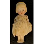 An early 20th century continental porcelain doll, possibly Belgian, fixed body, articulated arms,