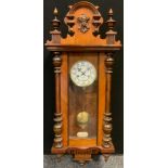 A Junghans 8-day Vienna wall clock, walnut veneered case, hour, and half hour striking, white