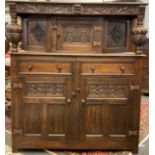 A carved oak court cupboard, 138cm high x 127cm wide x 44cm.