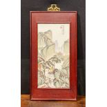 A Chinese rectangular plaque, painted with figures and pagodas in a monumental landscape,